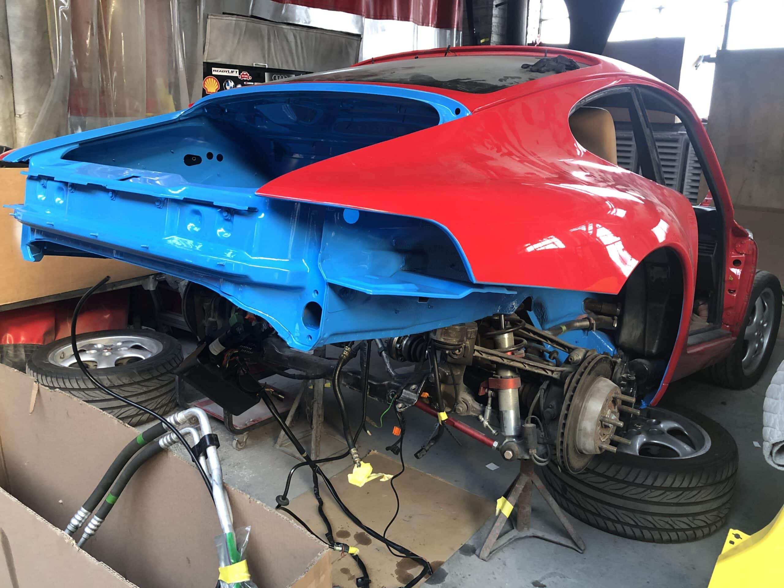Underside view of a car showcasing a vibrant blue paint job.