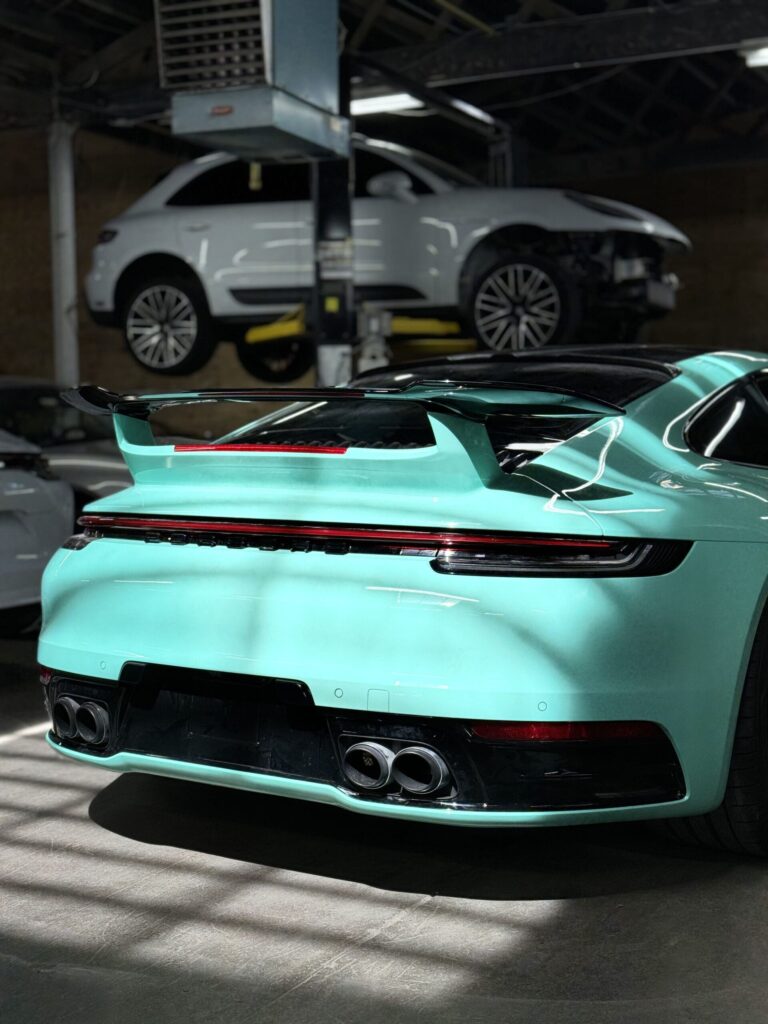 Custom Porsche 911 GT3 RS featuring an aerodynamic body kit, showcasing its sleek design and performance enhancements.